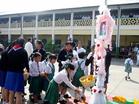 School children paying floral tribute to Lungnila Elizabeth at Little Flower School, Imphal at the First Death Anniversary on 4 November 2004