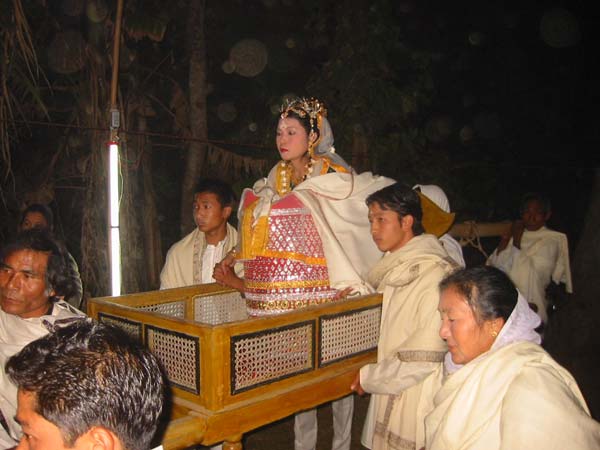 Keinya - Lu-hong-ba-gee Dollai-da - a Meitei marriage ceremony ending where the bride goes on top of a 'Dollai' with her hand tied to her brother who guides the bride to her new home