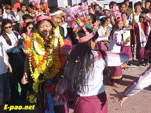 Kom Rems girls in their traditional dresses dancing during the reception of Mary Kom at Imphal Airport  on 6th November.