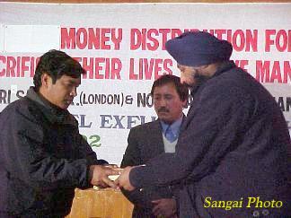Distribution of financial assitance donated by the Manipuris in United Kingdom and the North American Manipuri Association (NAMA)